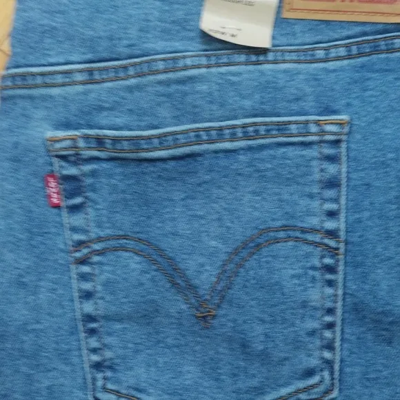 - Levi's ribcage straight ankle super high rise 5 pocket medium wash jeans