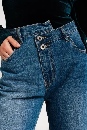 Asymmetric button detail straight jeans in mid blue