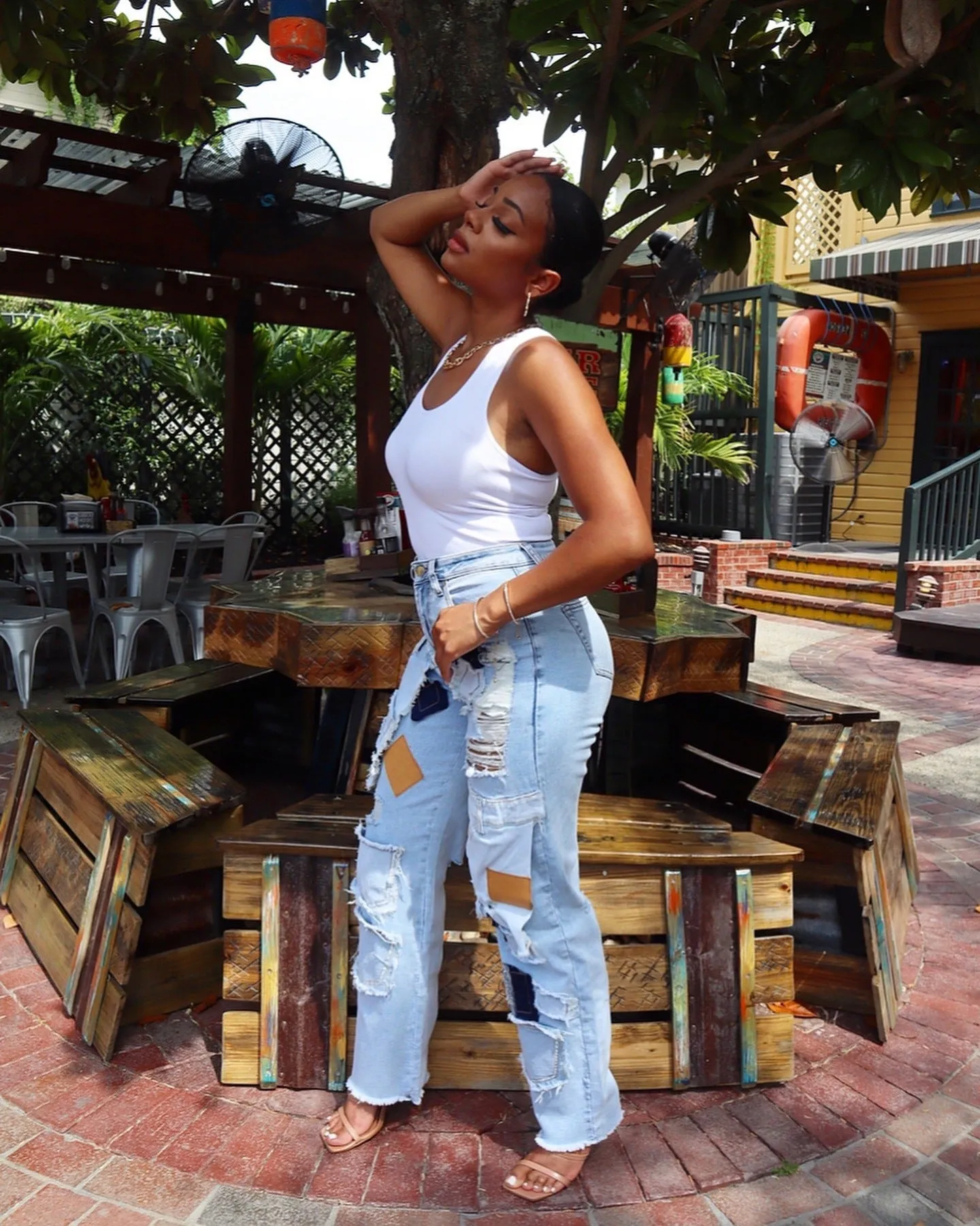 Bold Patchwork Ripped Denim Straight-Leg Jeans with Distressed Detailing