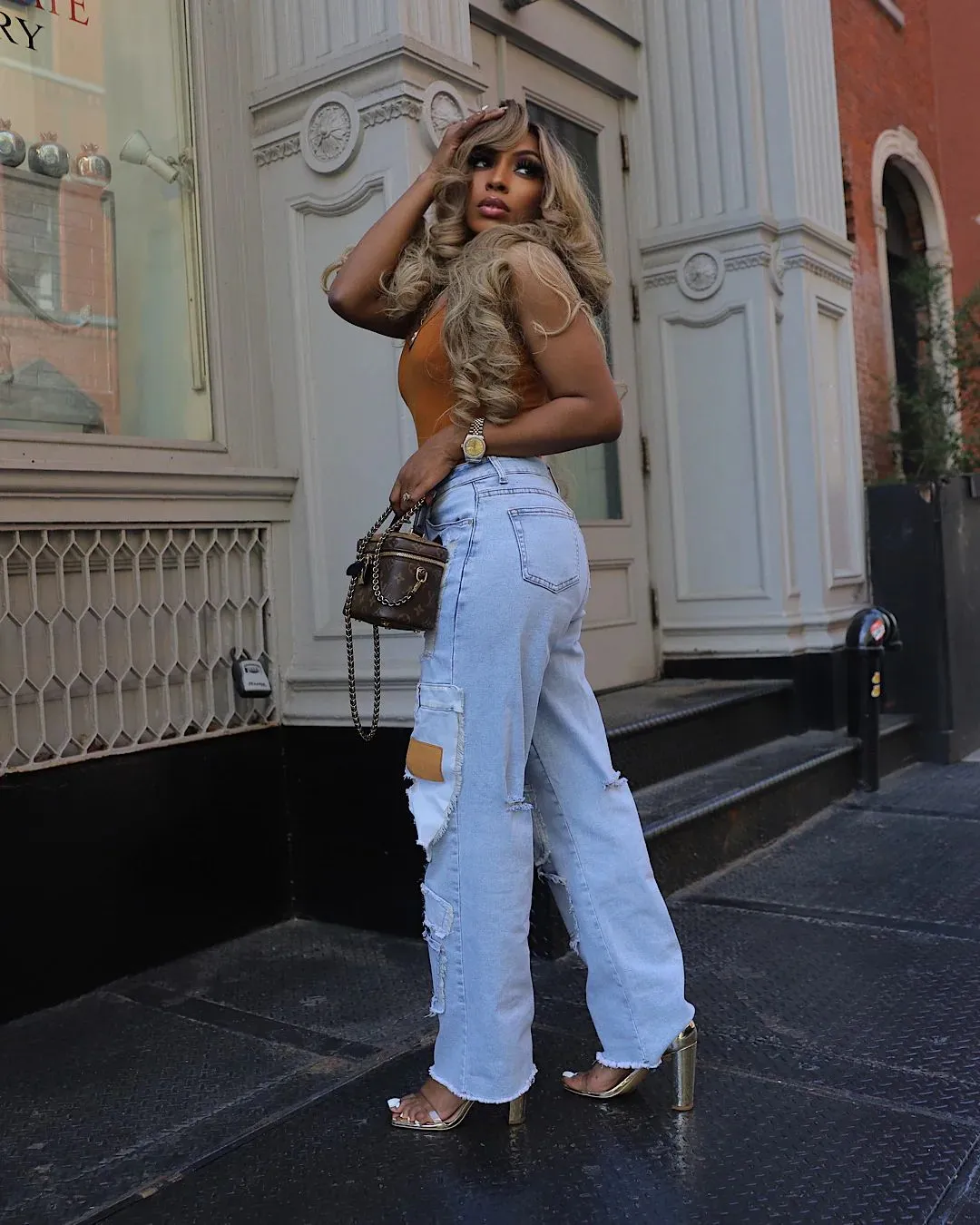 Bold Patchwork Ripped Denim Straight-Leg Jeans with Distressed Detailing