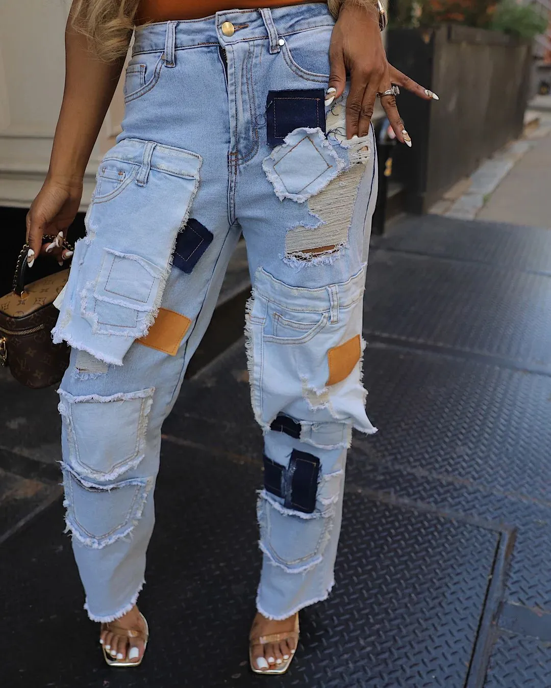 Bold Patchwork Ripped Denim Straight-Leg Jeans with Distressed Detailing