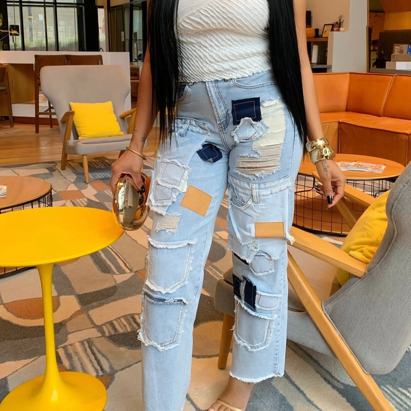 Bold Patchwork Ripped Denim Straight-Leg Jeans with Distressed Detailing