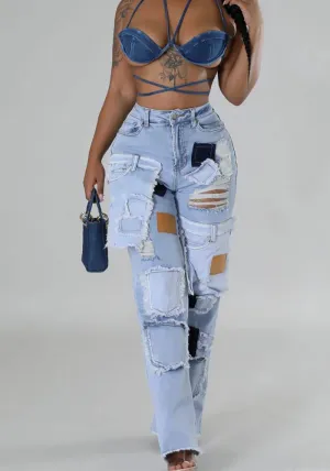 Bold Patchwork Ripped Denim Straight-Leg Jeans with Distressed Detailing