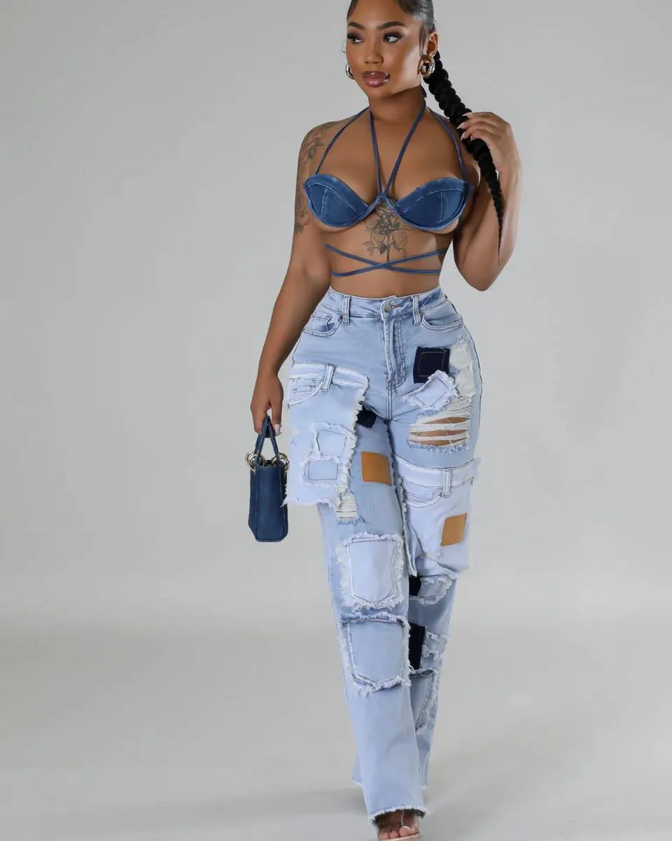 Bold Patchwork Ripped Denim Straight-Leg Jeans with Distressed Detailing