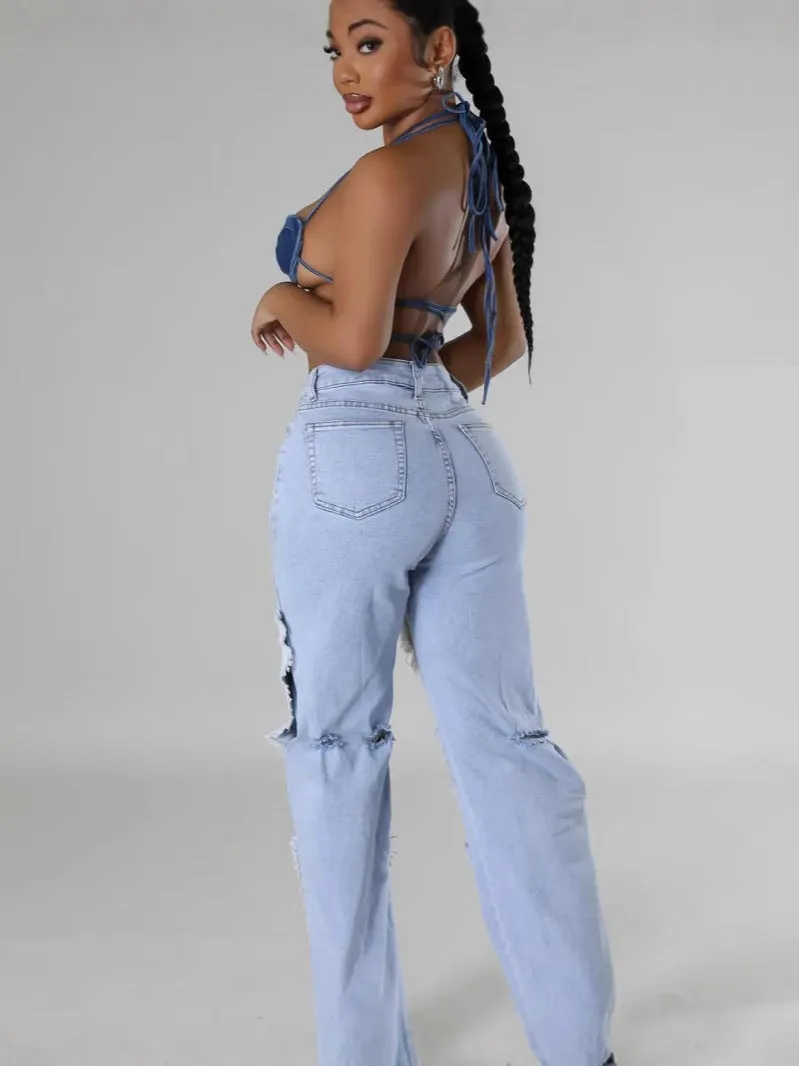 Bold Patchwork Ripped Denim Straight-Leg Jeans with Distressed Detailing