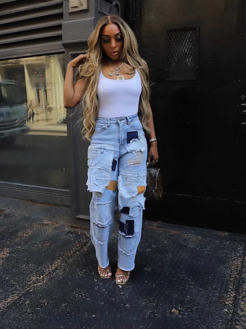 Bold Patchwork Ripped Denim Straight-Leg Jeans with Distressed Detailing