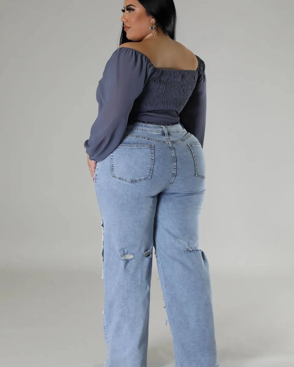 Bold Patchwork Ripped Denim Straight-Leg Jeans with Distressed Detailing