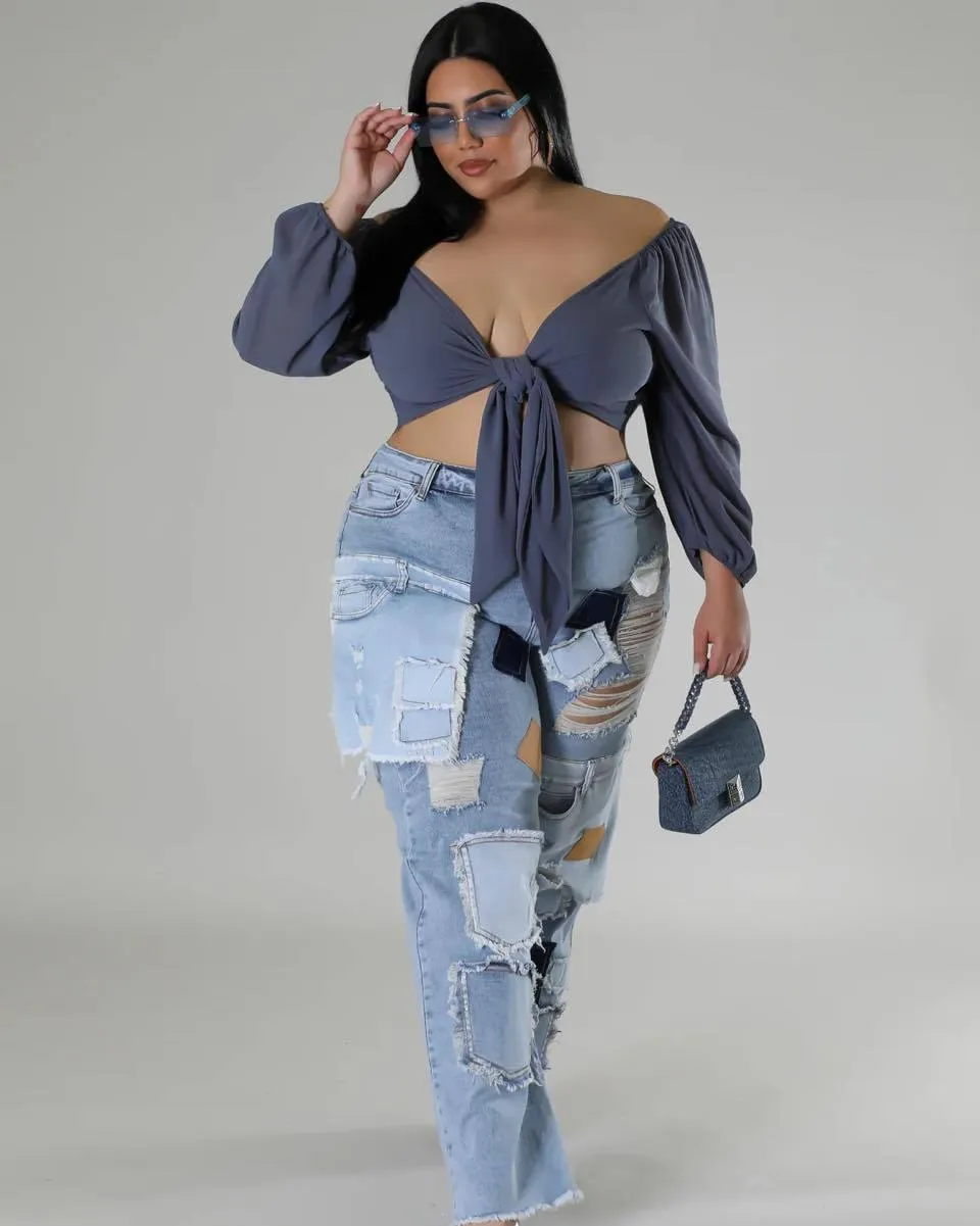 Bold Patchwork Ripped Denim Straight-Leg Jeans with Distressed Detailing