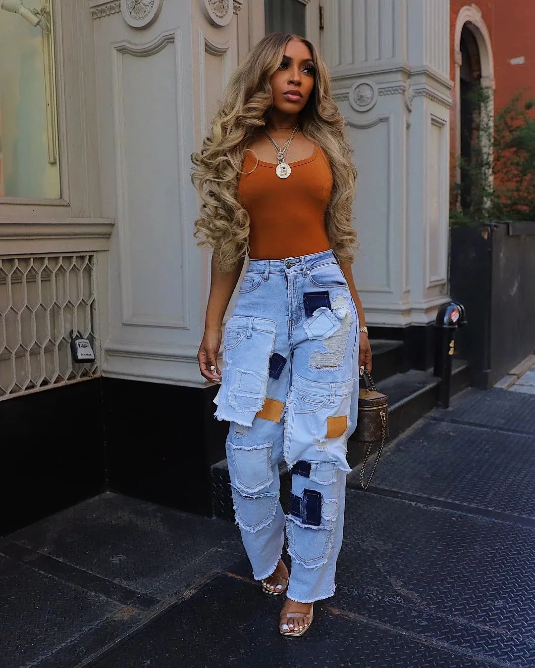Bold Patchwork Ripped Denim Straight-Leg Jeans with Distressed Detailing