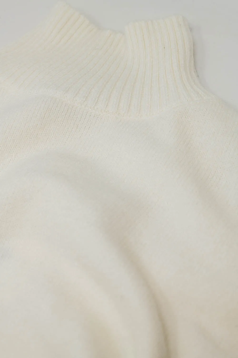 chunky knit sweater in ecru with turtleneck