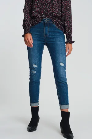 High waisted skinny jeans in dark wash blue with ripped details
