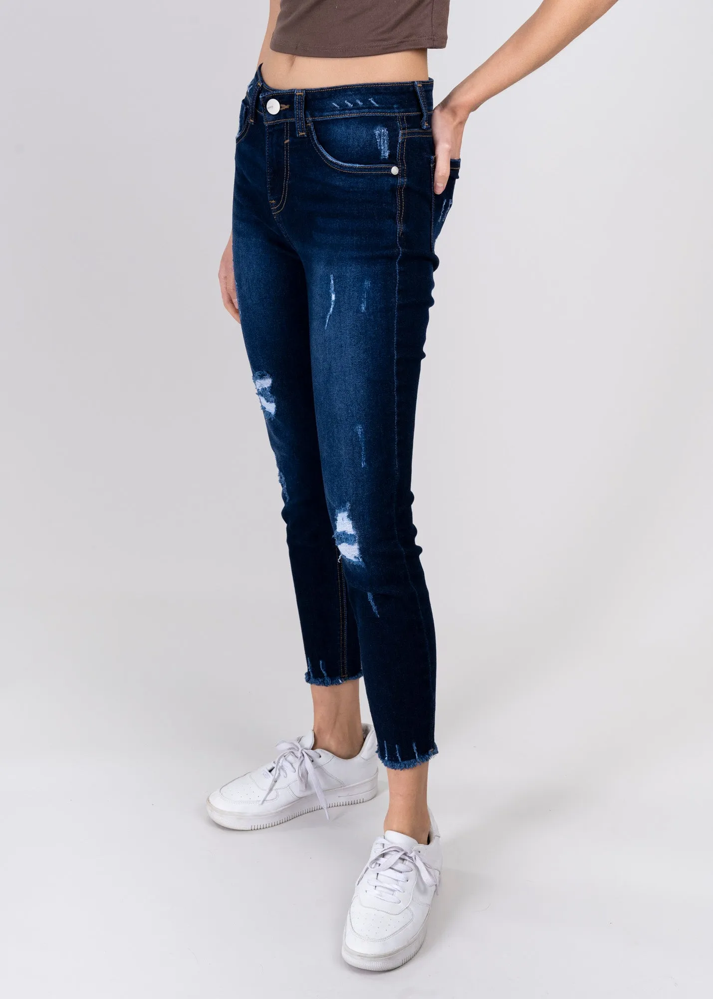Jeans cintura media destrucciones flecos